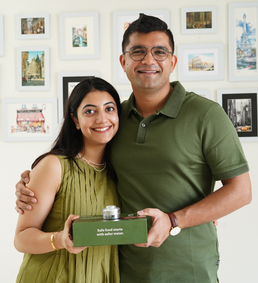 The founders holding the Verra Kitchen Membrix water purifier box.